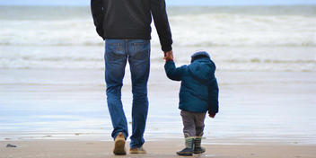 Father and son on the beach