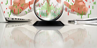 Crystal ball and businessman with chart graphs