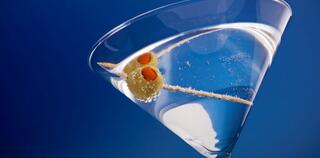 Martini with olive in a glass