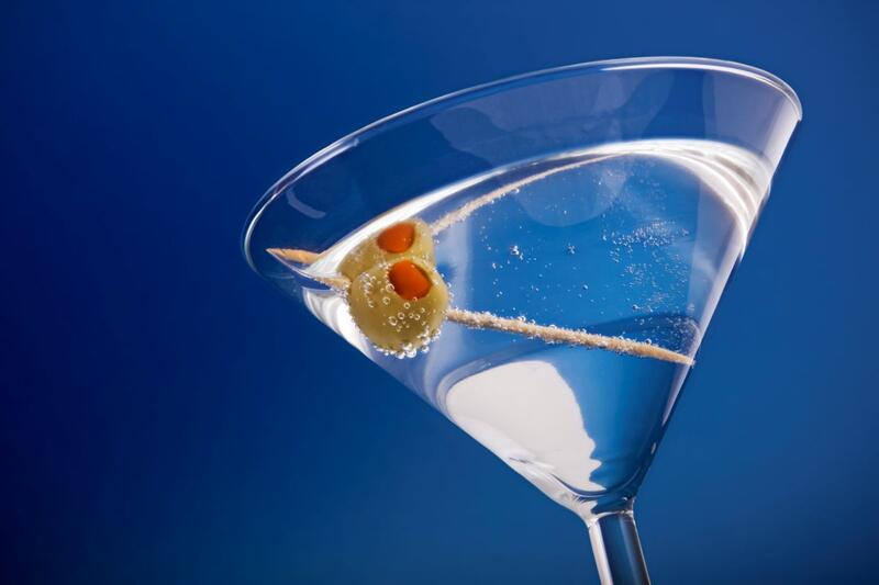 Martini with olive in a glass